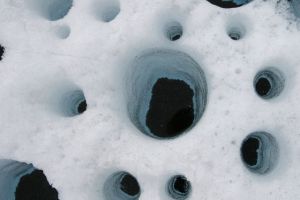 Multiple cryoconites (http://icestories.exploratorium.edu/dispatches/mintaure-ecosystems-on-the-ice/)